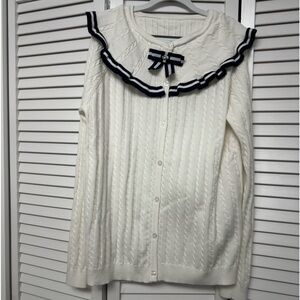 Big girl brand new button up sweater with a bow detail.